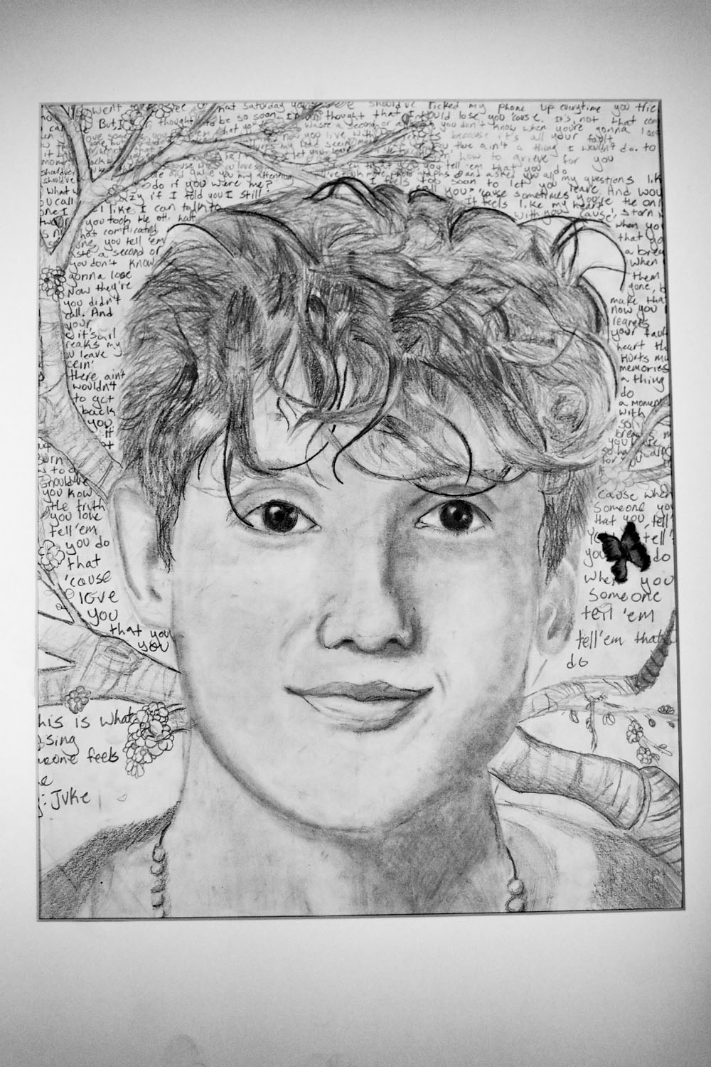 Pencil drawing of boy with curly hair