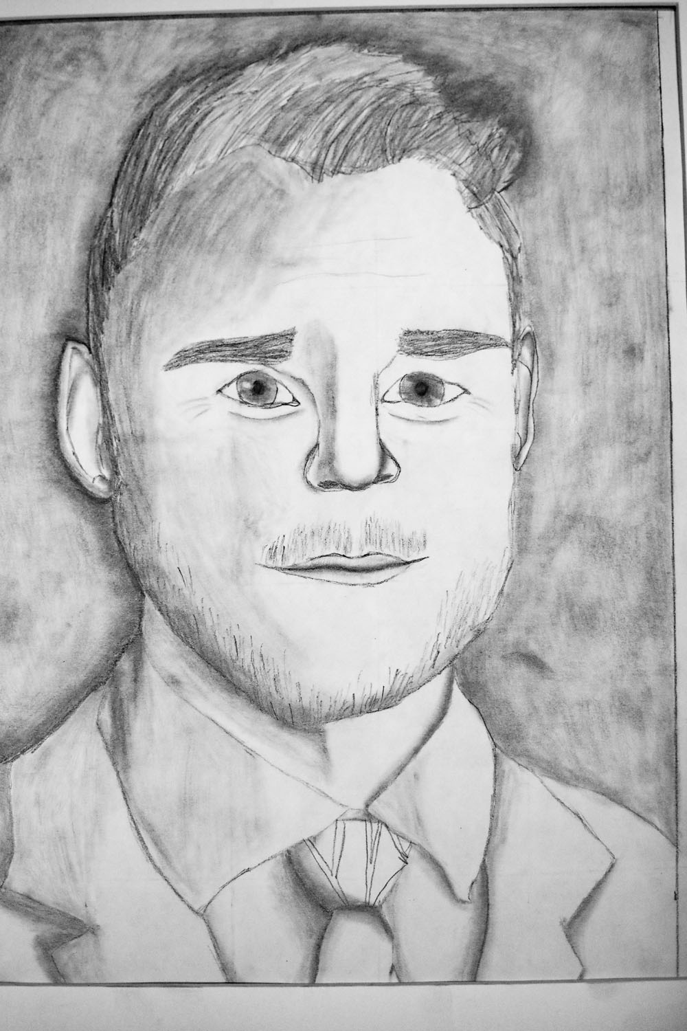 Pencil drawing of a man in suit and tie