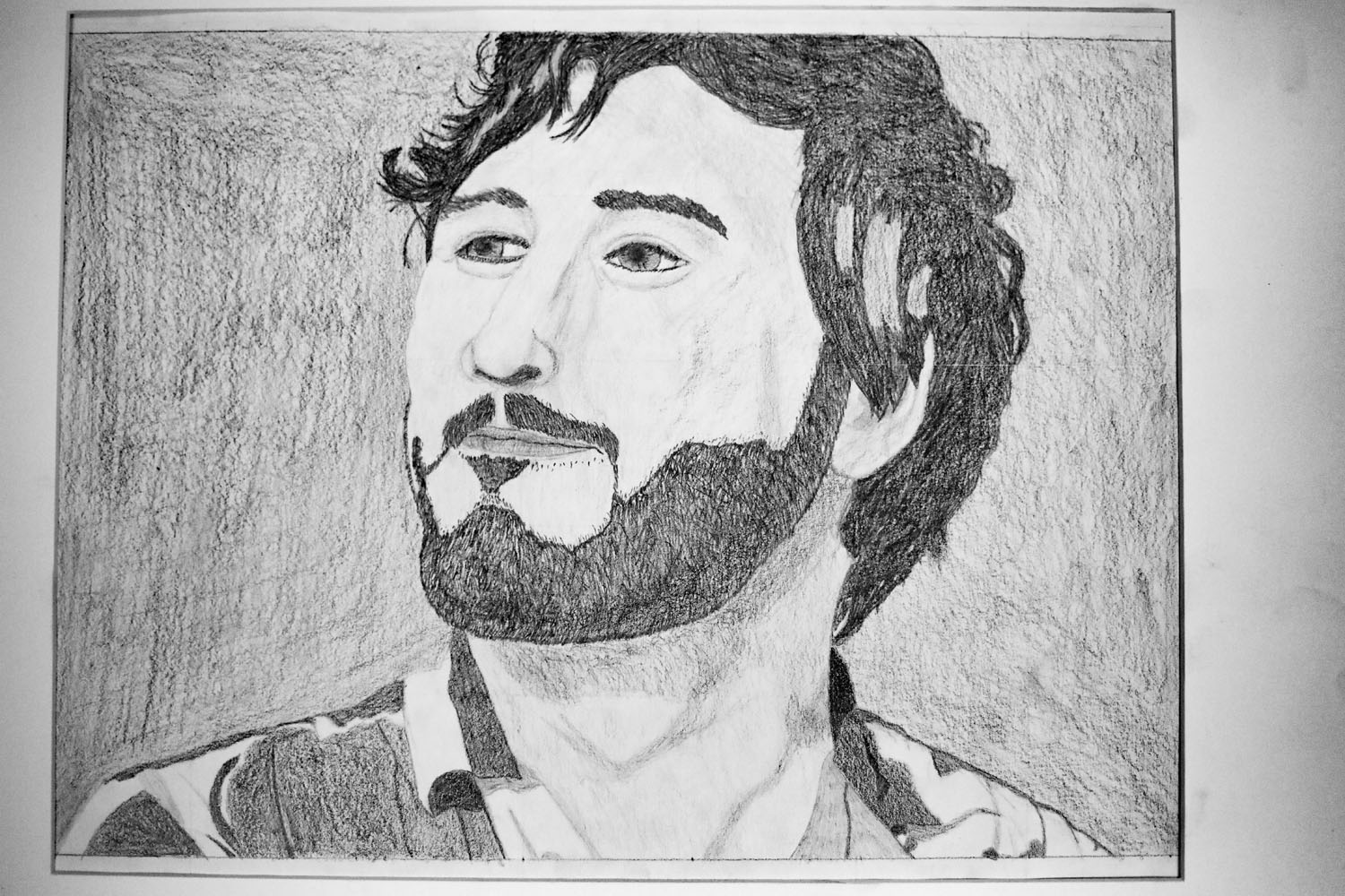 Pencil drawing of a man with a dark beard