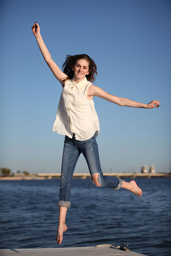 Senior in HS jumping into the air