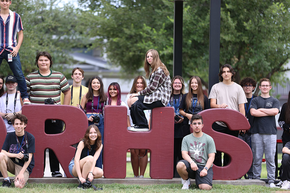 A group of digital photo studets by the DRHS letters