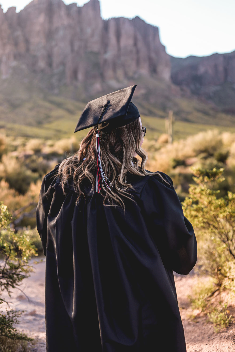 Graduate posing outside