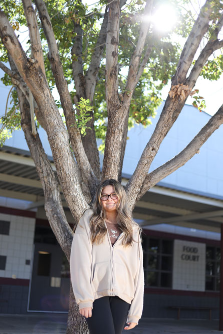 Kaysha by a tree in the courtyard