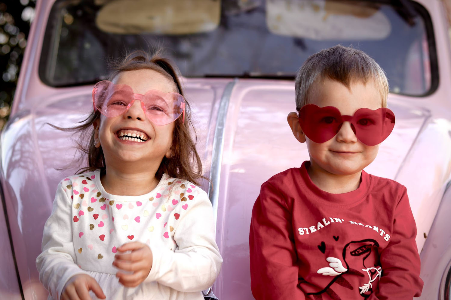 Two kids with sunglasses smiling