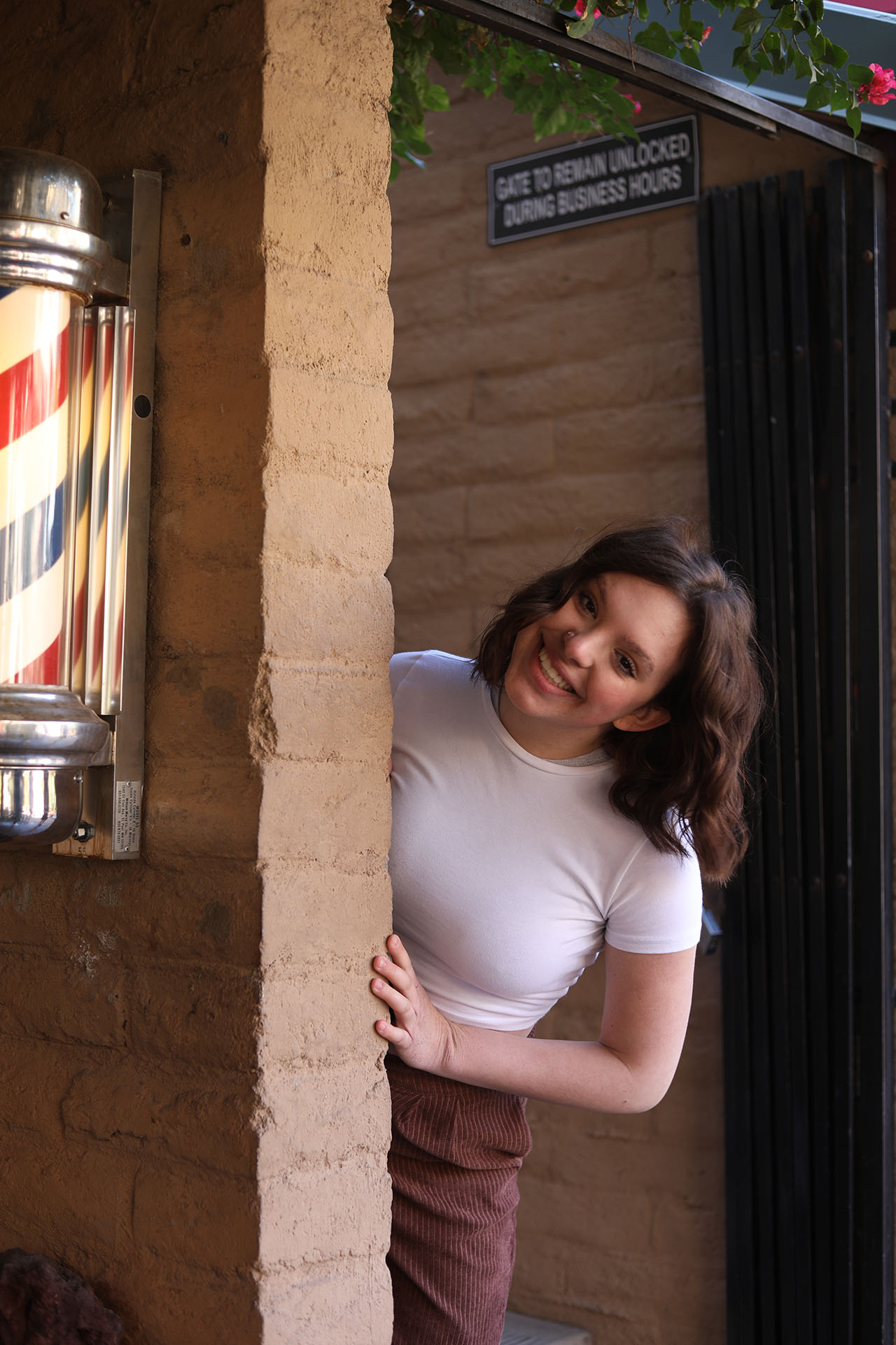 DRHS Dancer on Mill Ave. peeking out from a store front