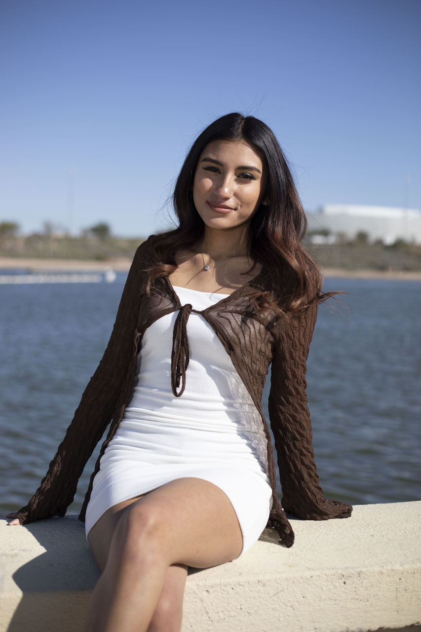 Janelle stitting in front of Tempe Town Lake