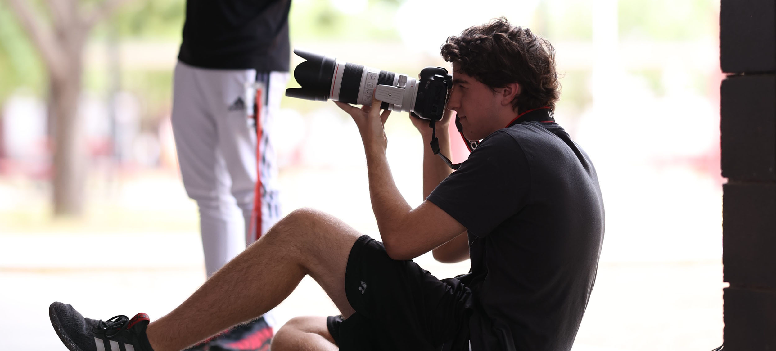 Kaden taking pictures in the courtyard