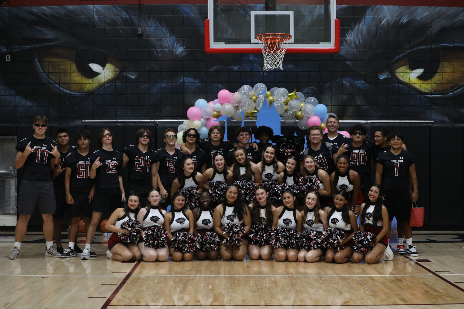 Pom and Football Players posing