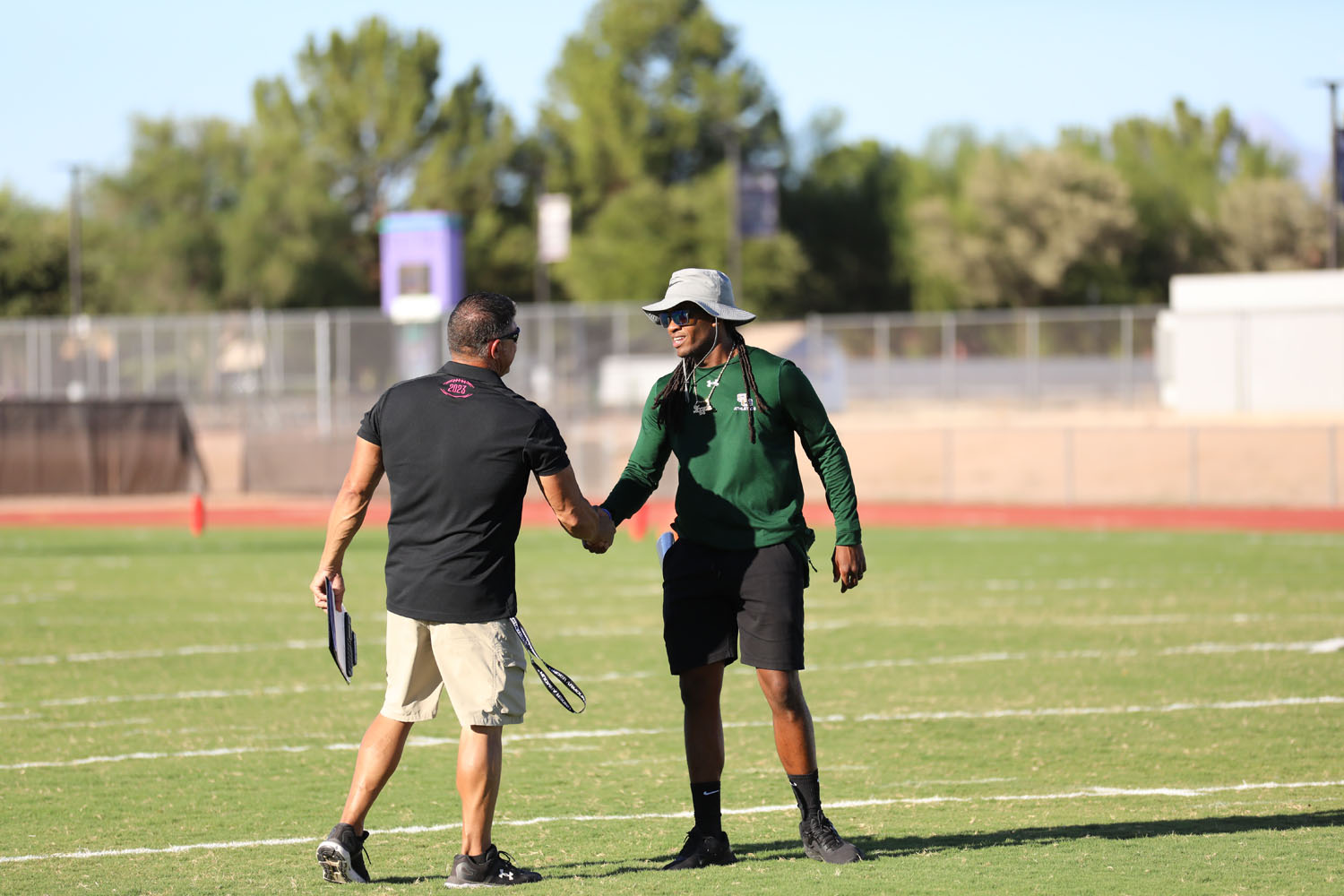 Coaches of the team meet on the field