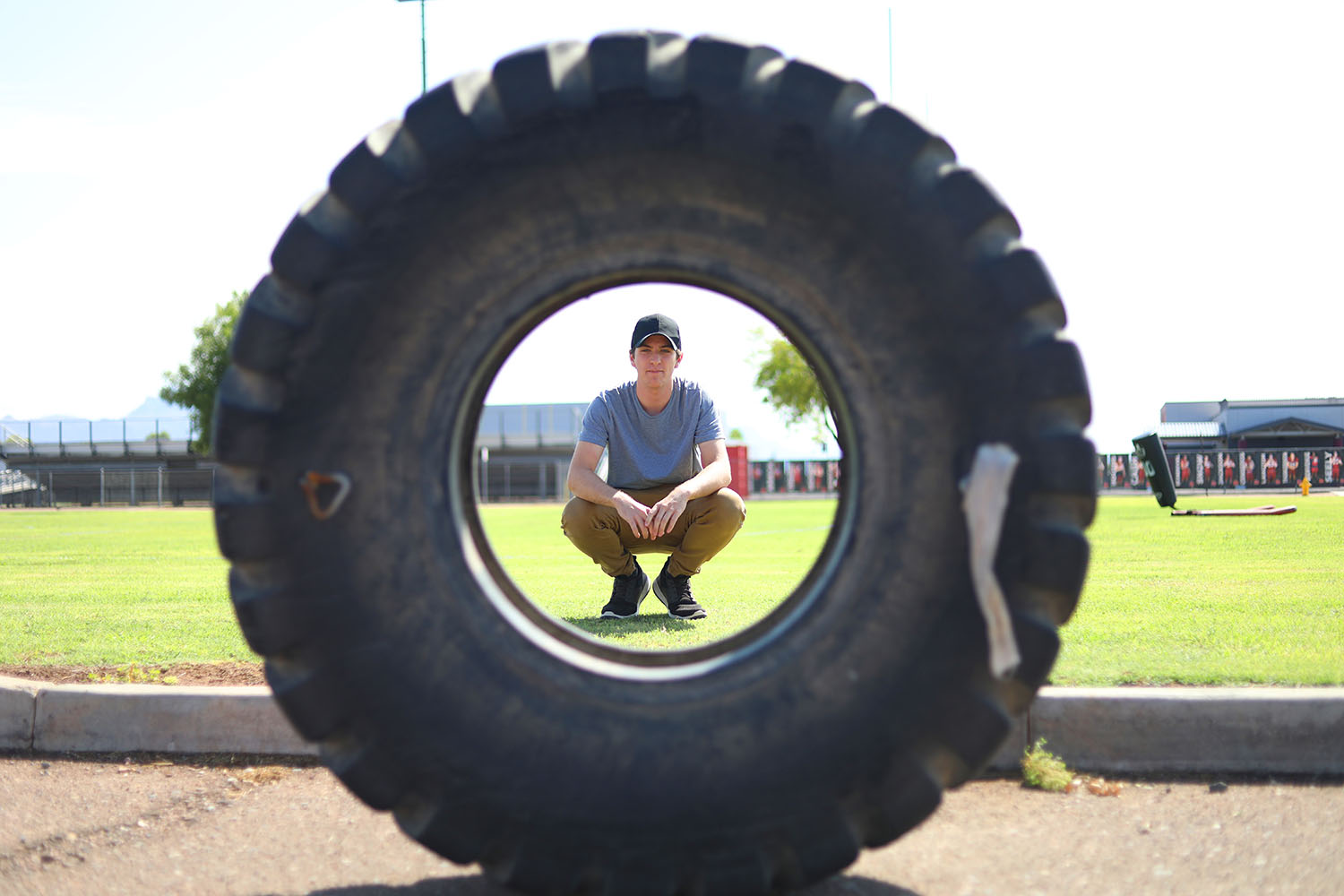 Framed photo of Kaden by a tire