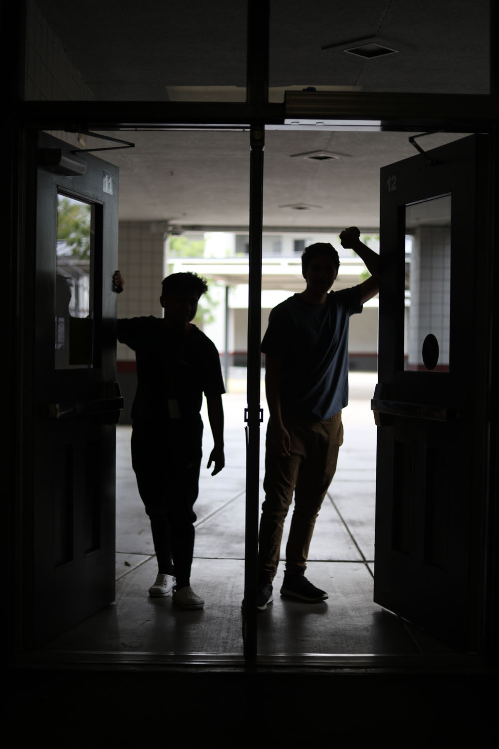 Silhouettes of 2 students