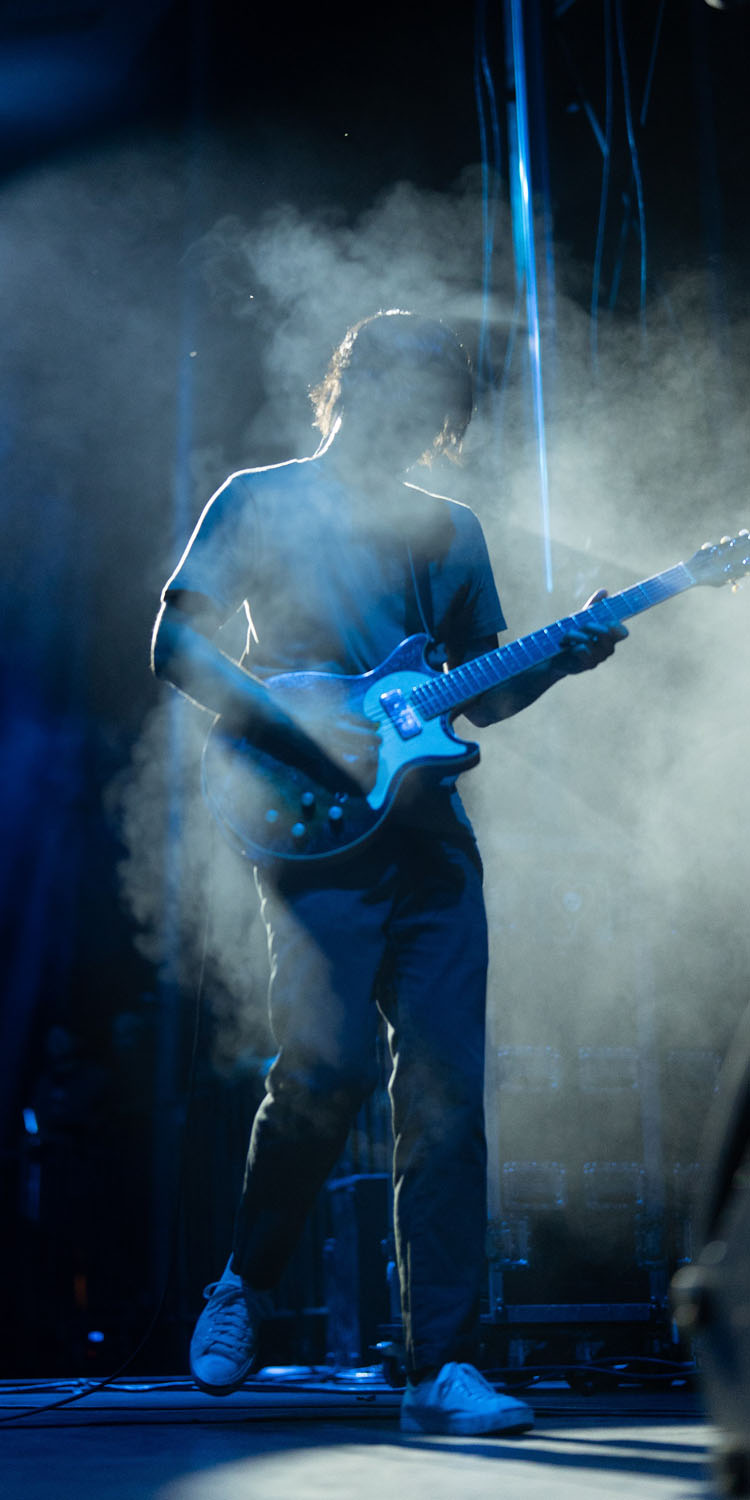 Guitarist in fog playing