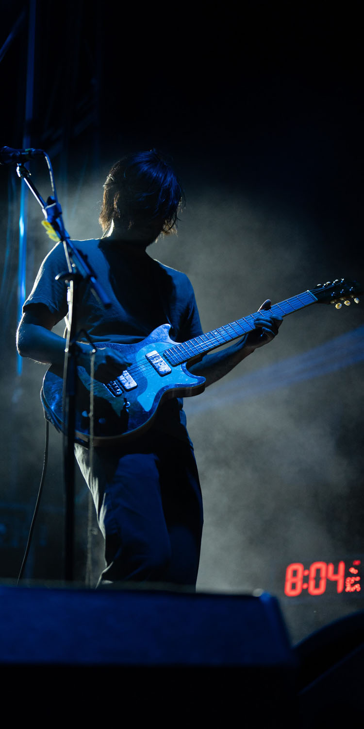 Guitarist in light playing