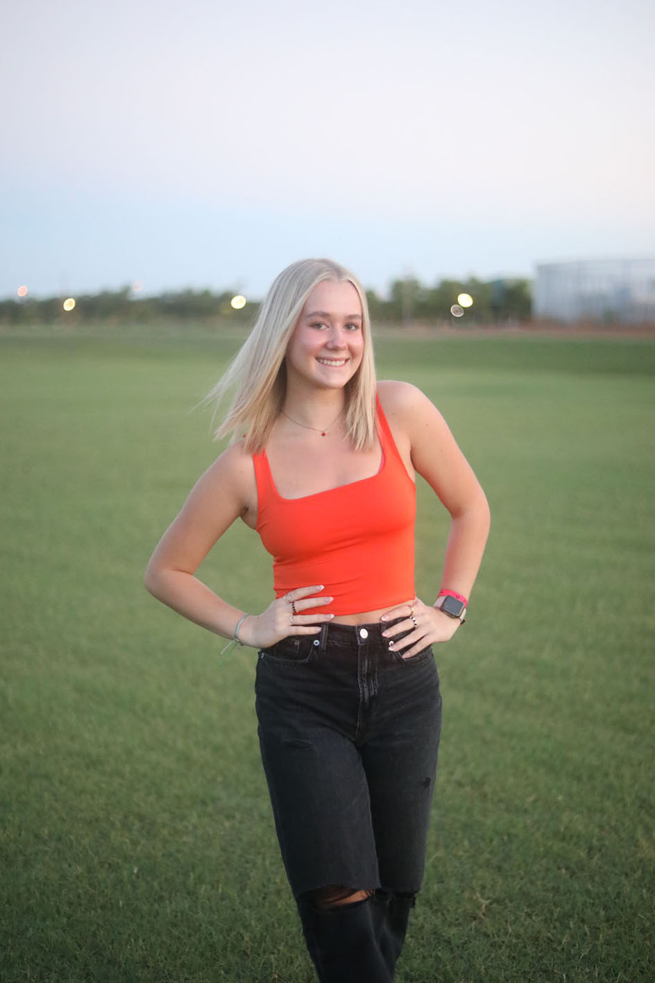 Kennedy smiling in a field