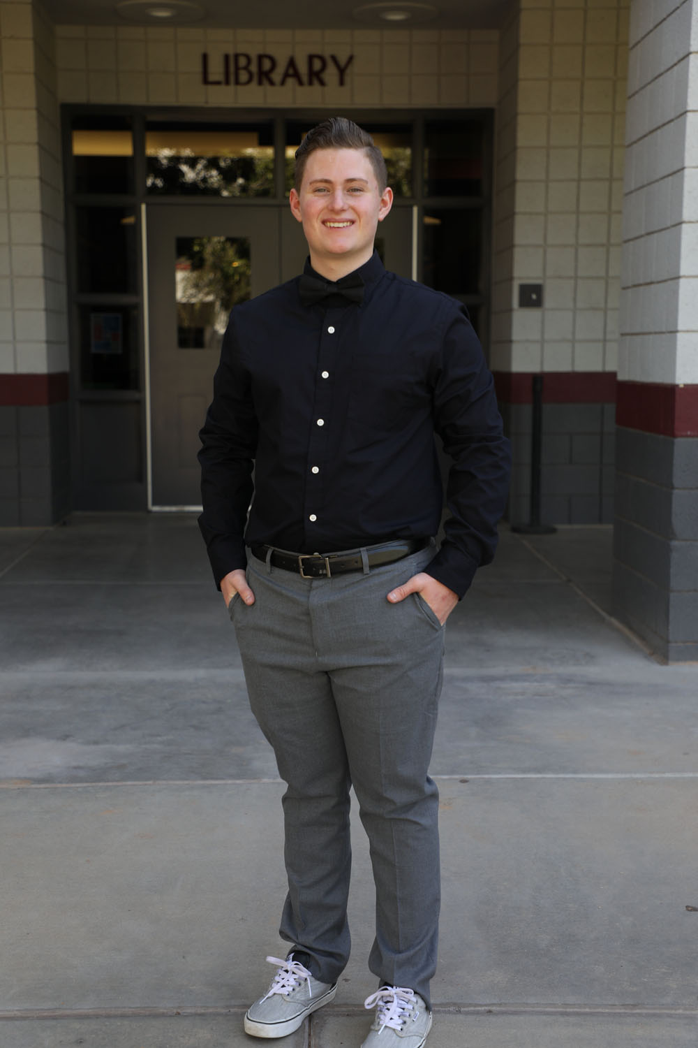 Jayden in front of the library