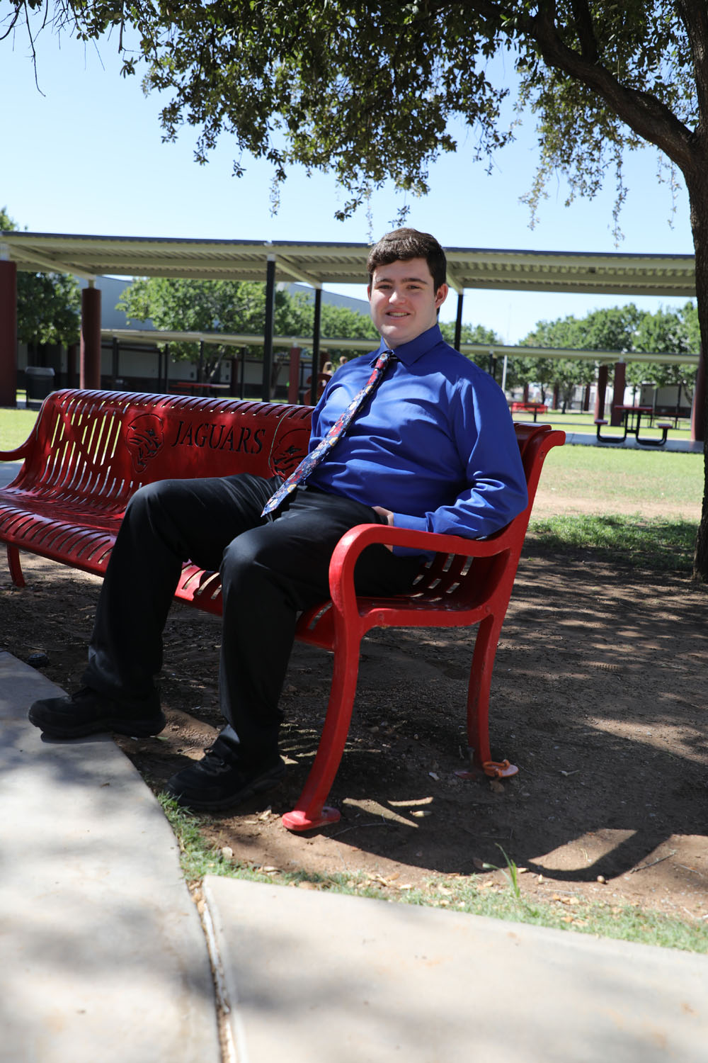 Matthew on a bench in courtyard