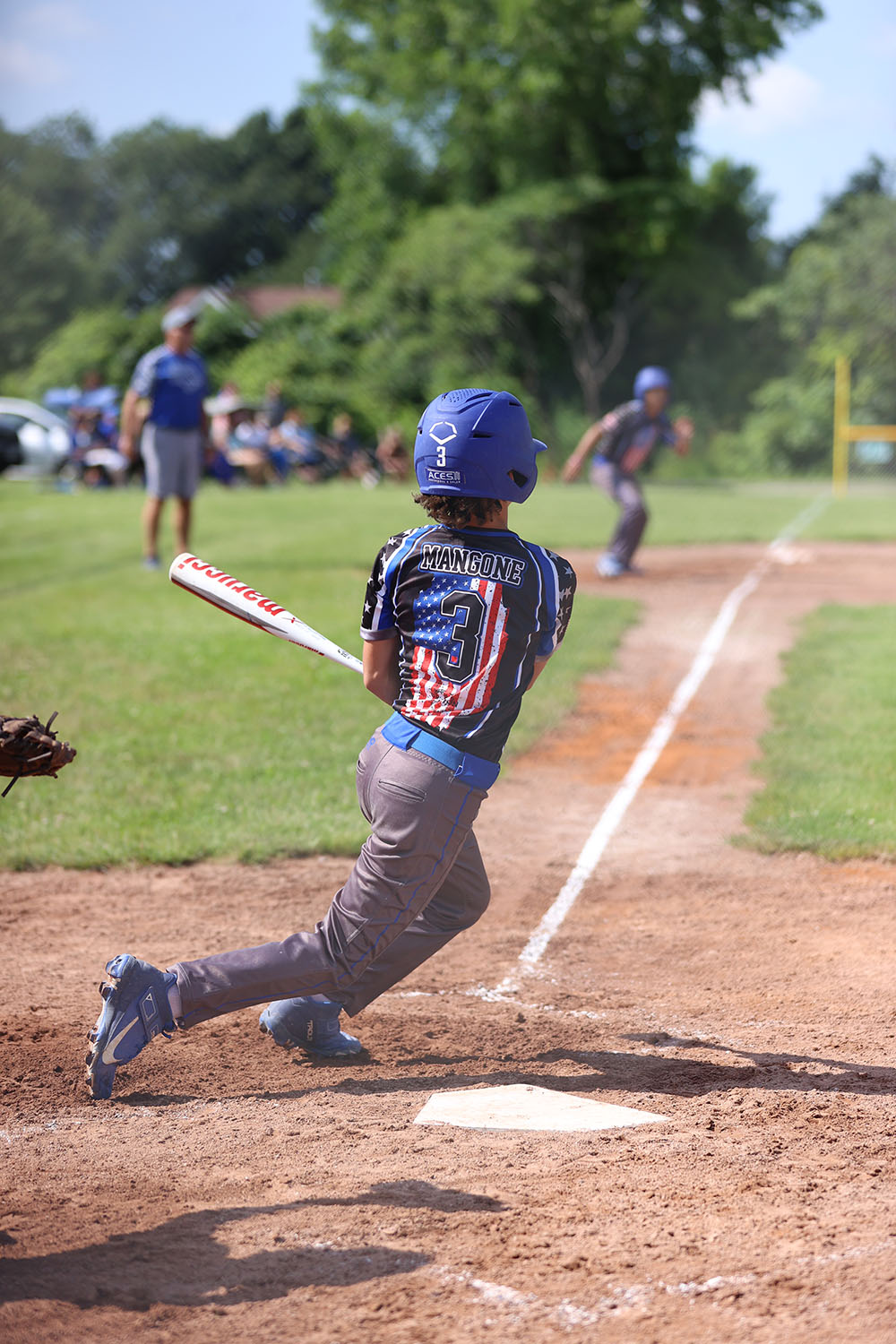 Evan running to first base