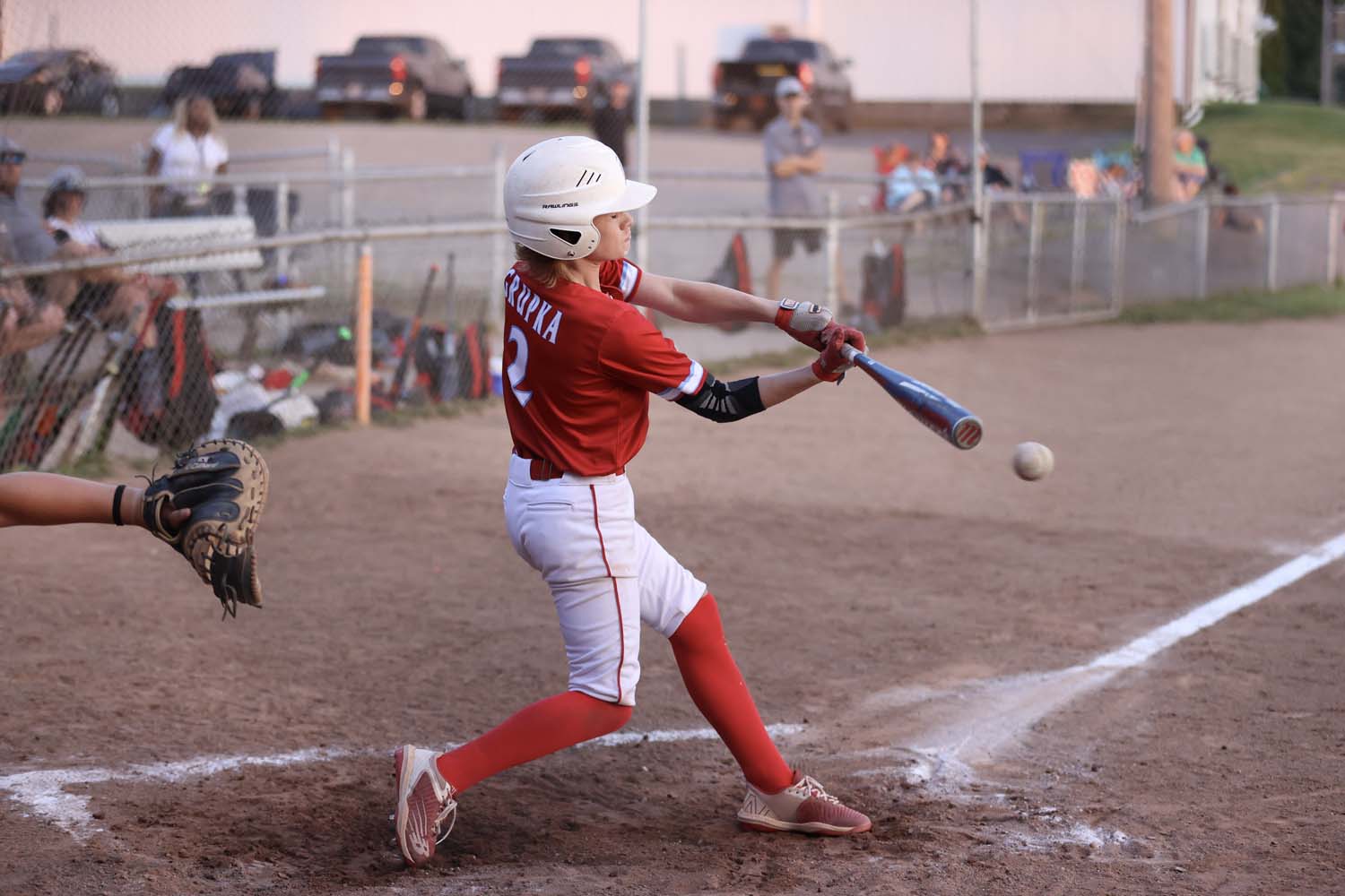 Lancaster player hitting the ball into the field