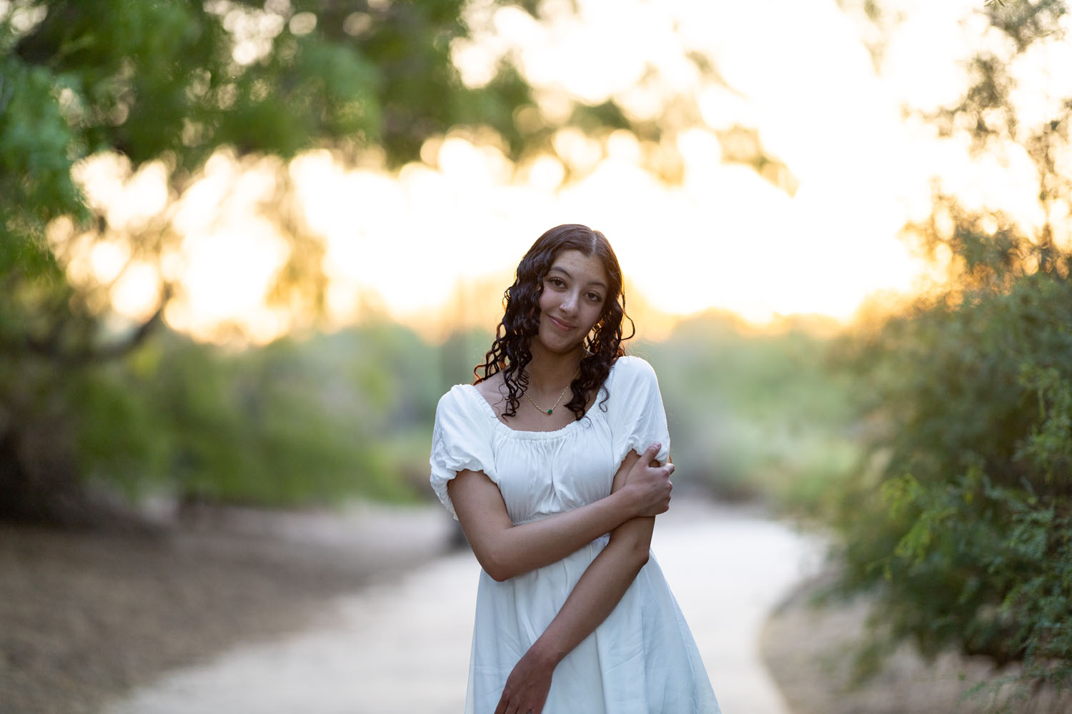 Young Lady standing on a sidewalk