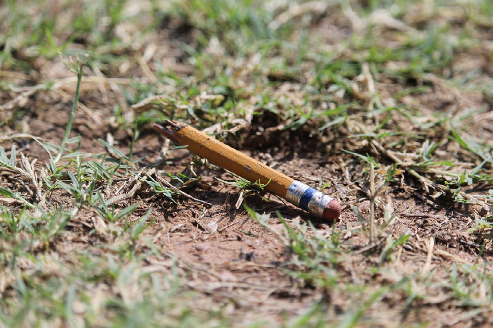 Broken pencil on the ground