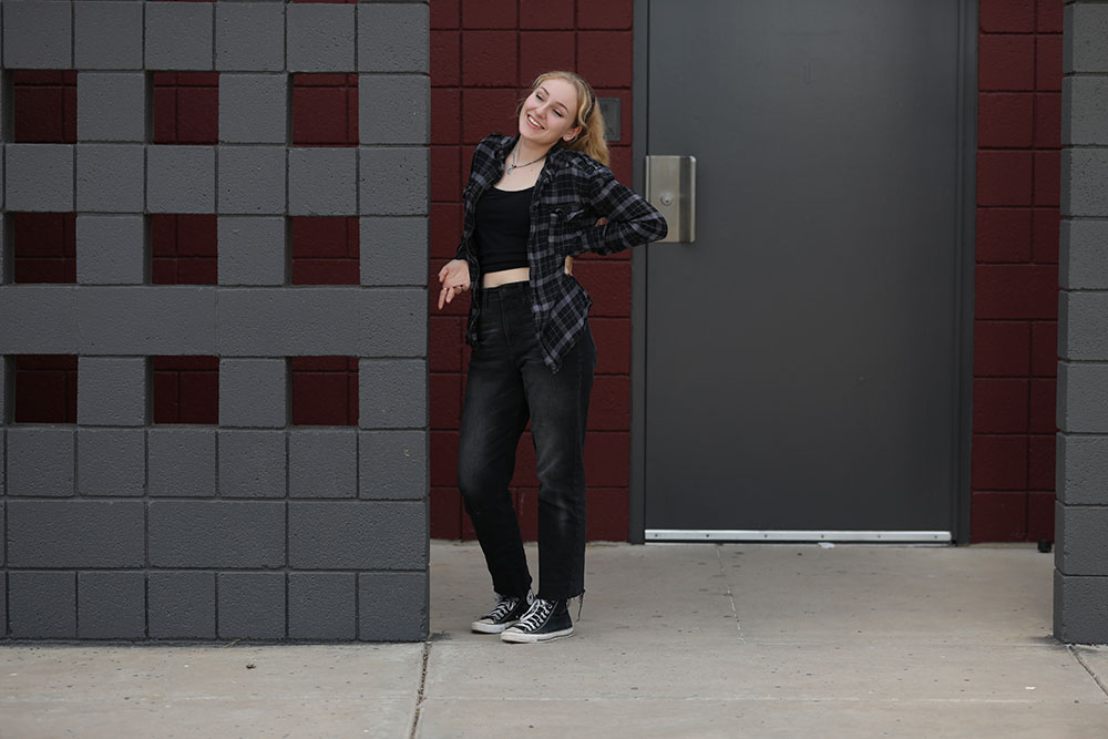 Person Posing Next To Wall