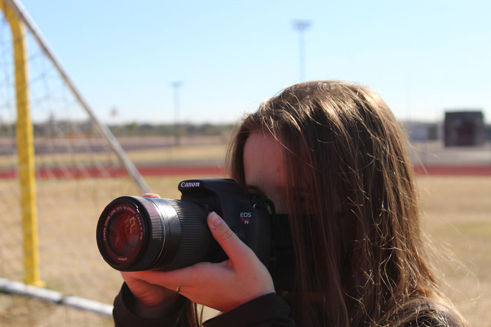 Girl holding camera