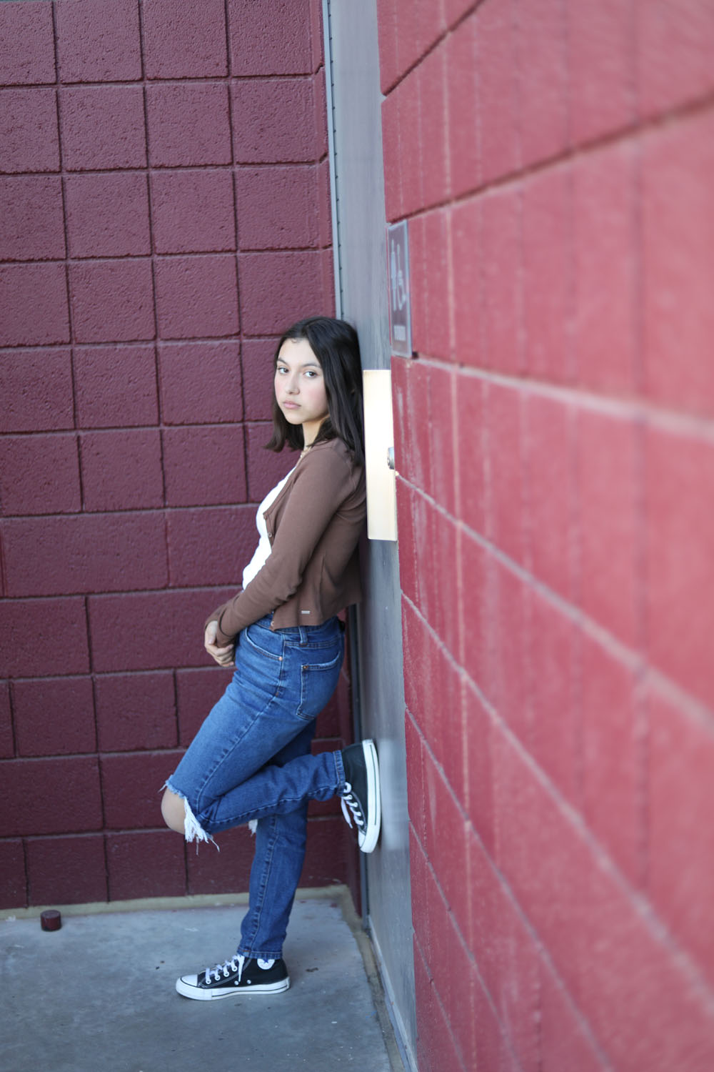 Girl leaning on a wall