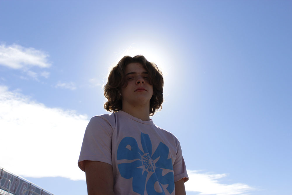 Portait of Alex in front of the sun