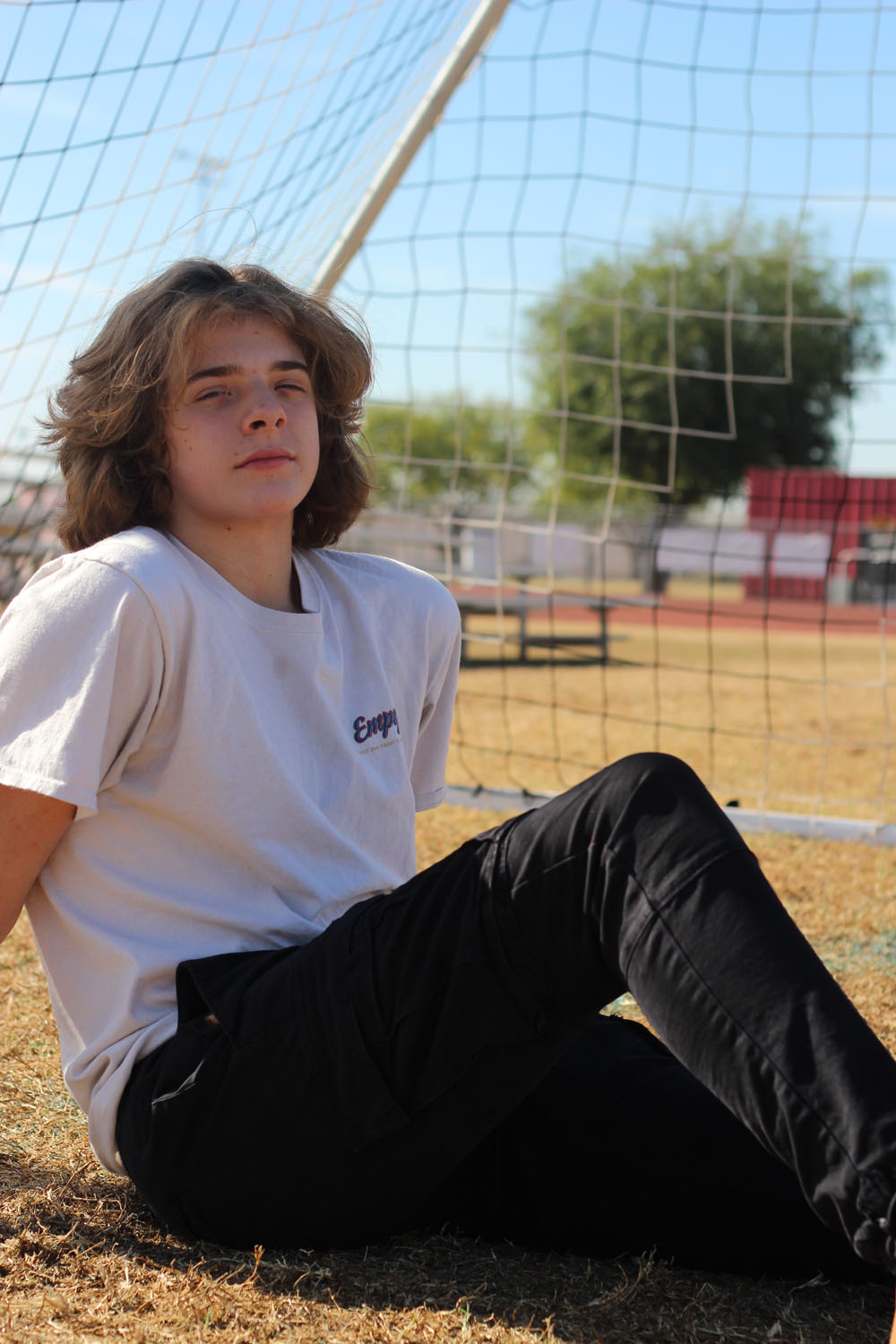 Alex posing in front of soccer goal