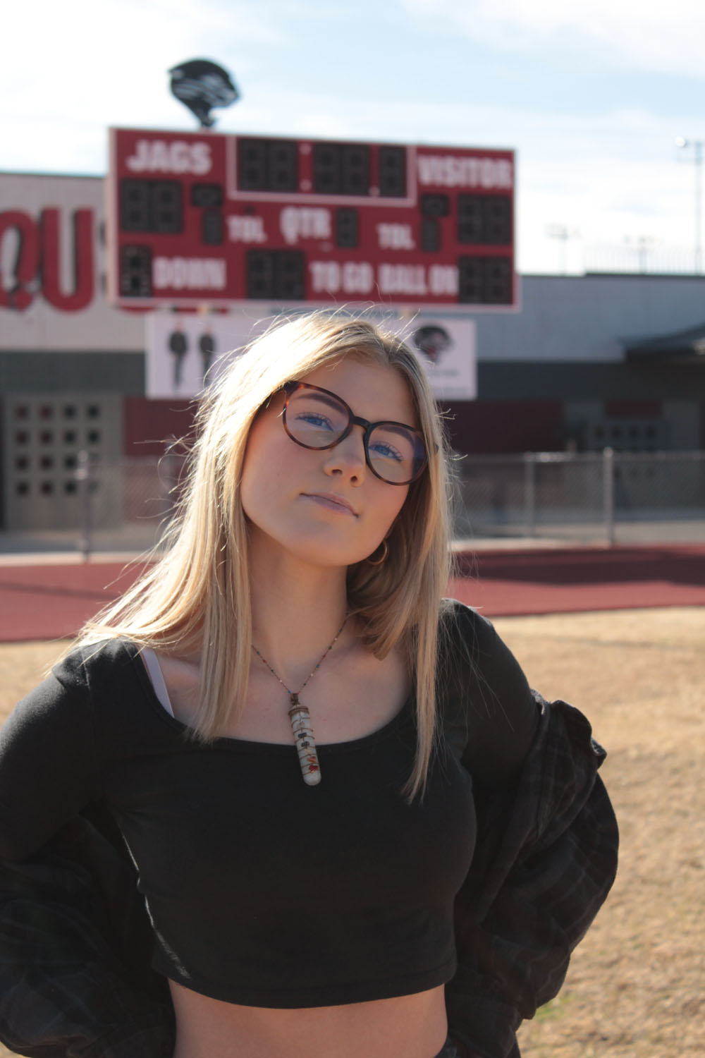 Hailee in front of scoreboard