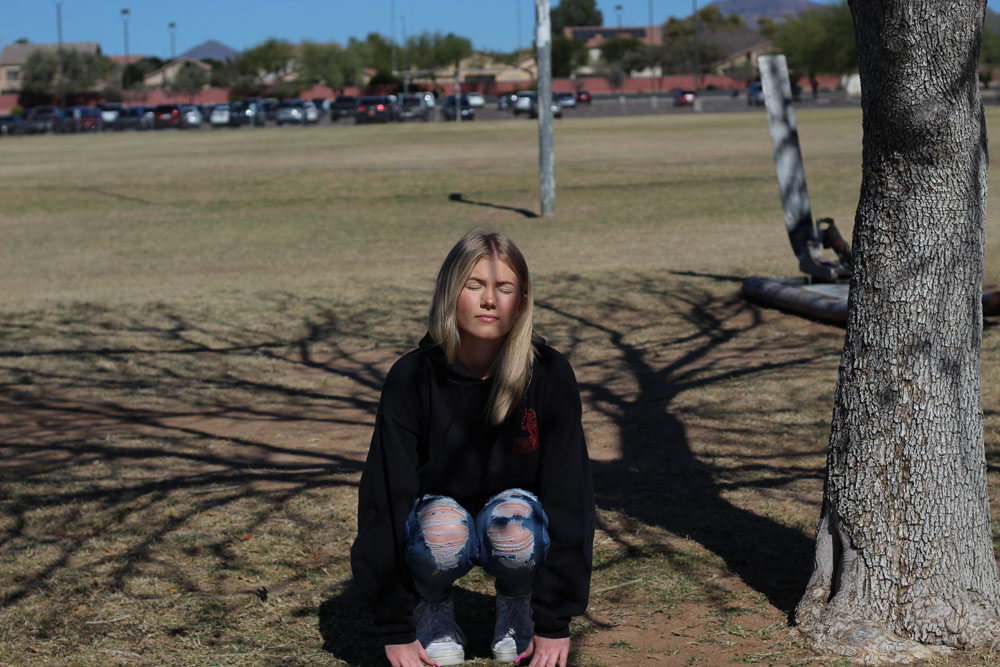 haillee sitting down on the practice field