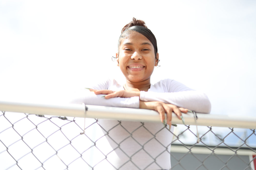 Girl on fence