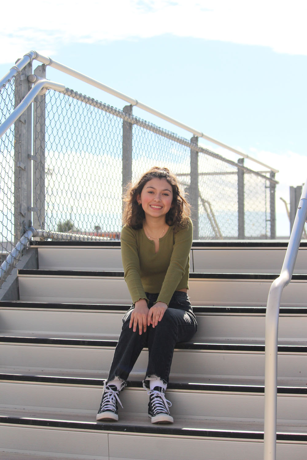 girl sitting on side steps