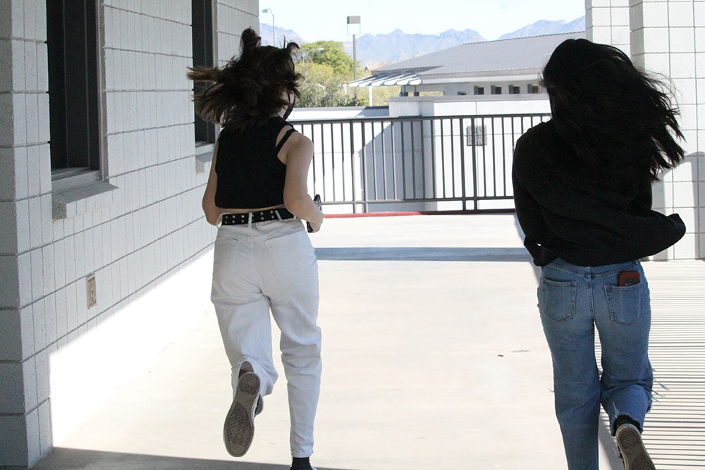 Samantha and Alexia ruinning through hallway