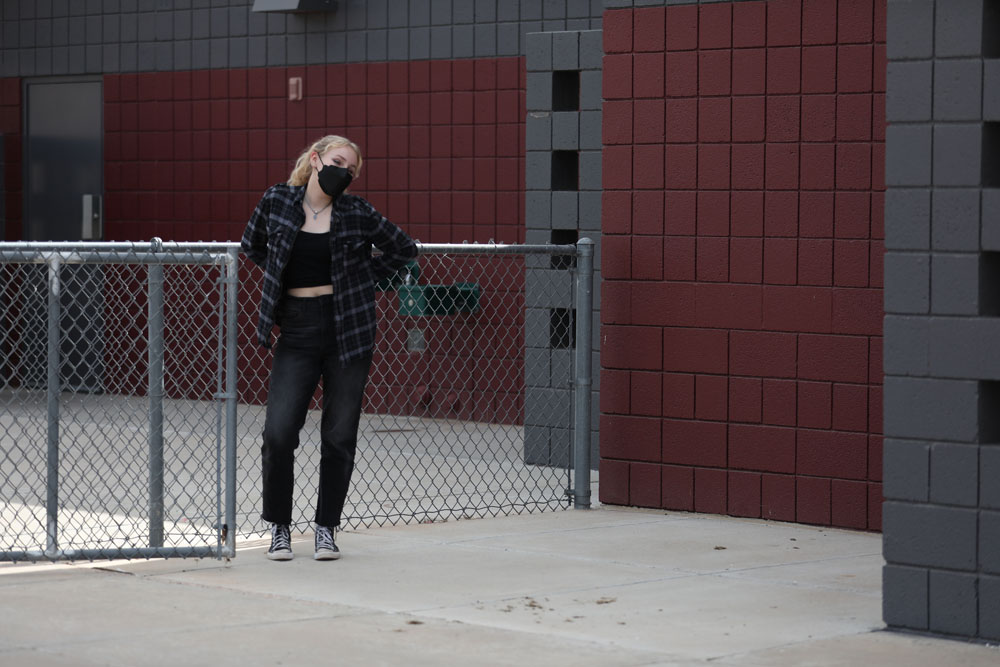 Jocelyn leaning On a Fence