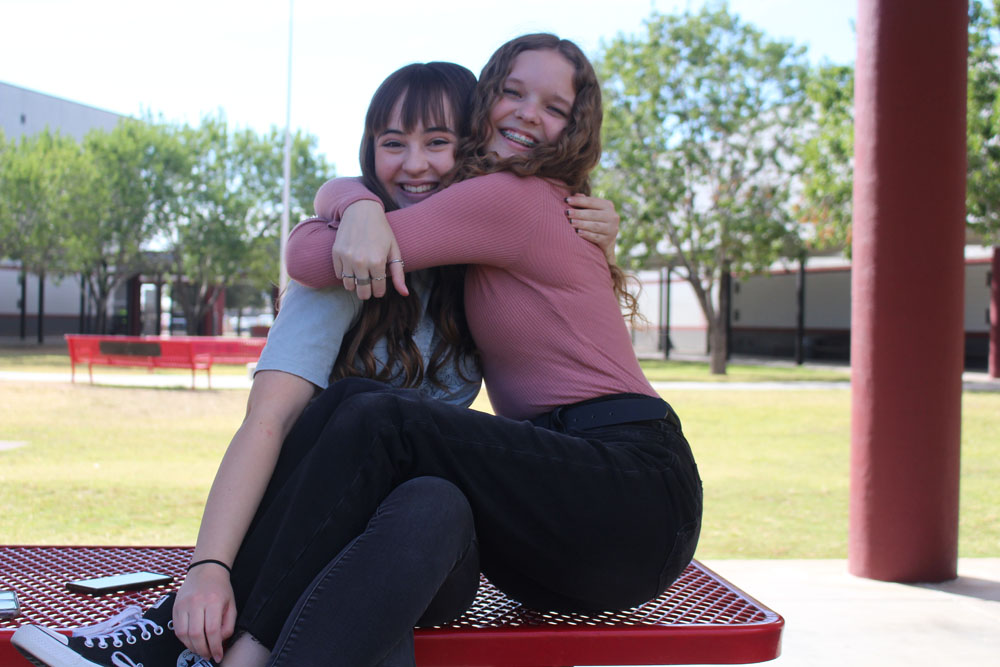 joey-and-kamry-hugging-sitting-on-a-bench