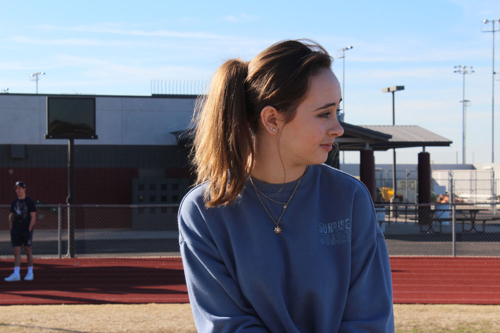 joey's-side-profile-sitting-on-the-bleachers