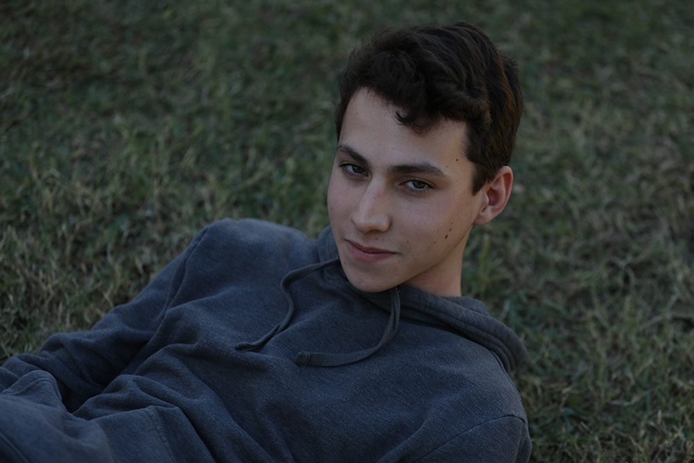 Grant laying in the courtyard's grass.