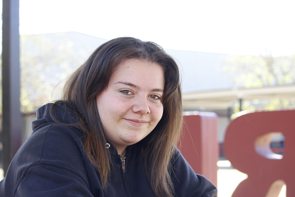 Chloe sitting on bench