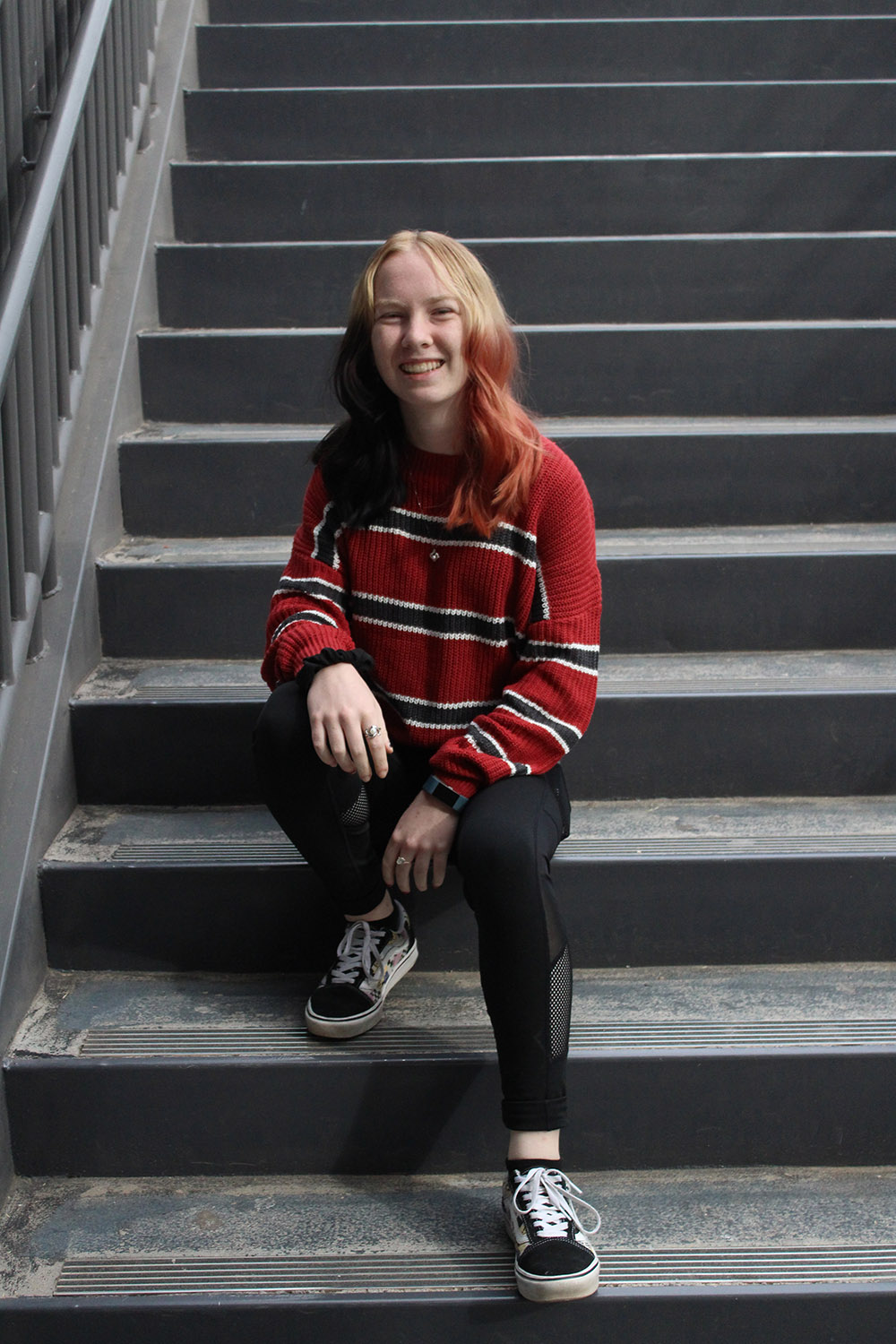 Kaydence sitting on stairs