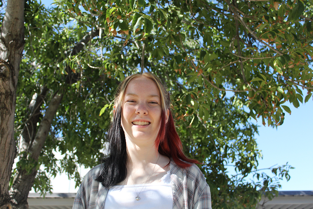 kaydence in front of tree