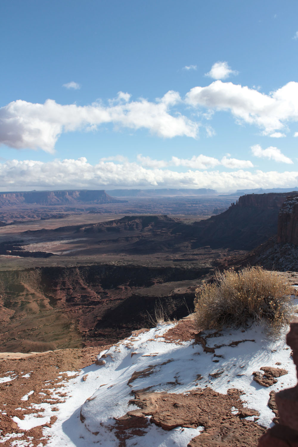 A snow patch on the mountain with more mountain views in the background.